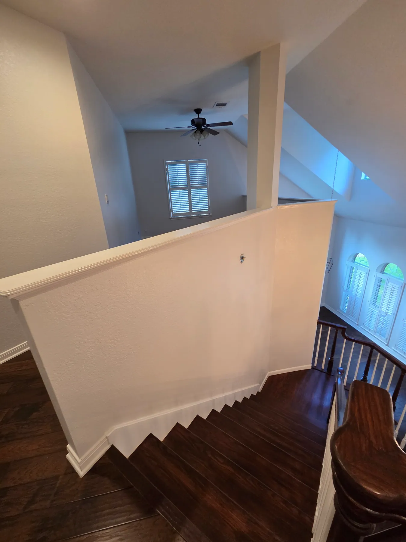 Austin staircase with vaulted ceiling and upper wall surfaces