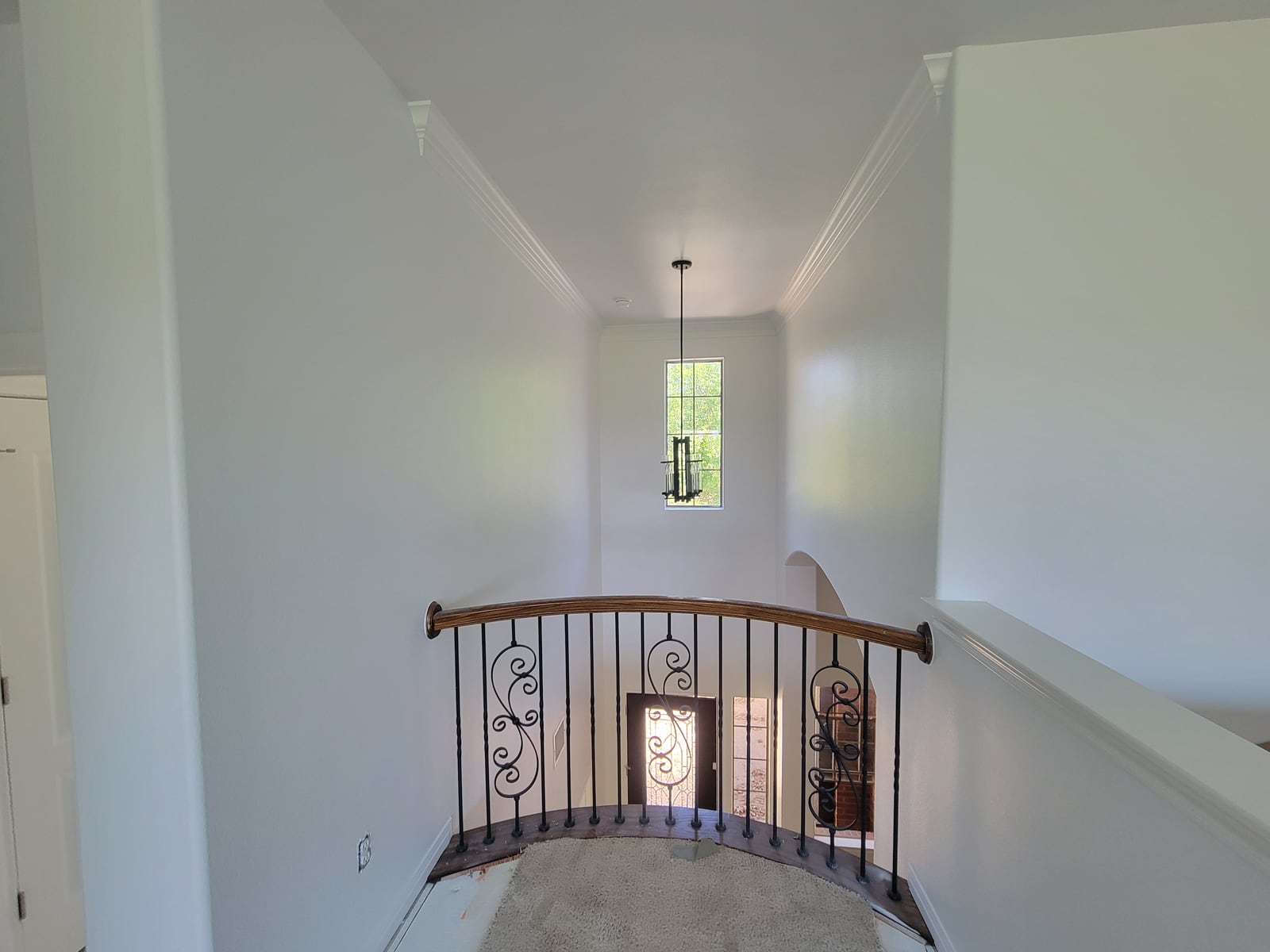 Finished painted walls and stair railing in an Austin area home