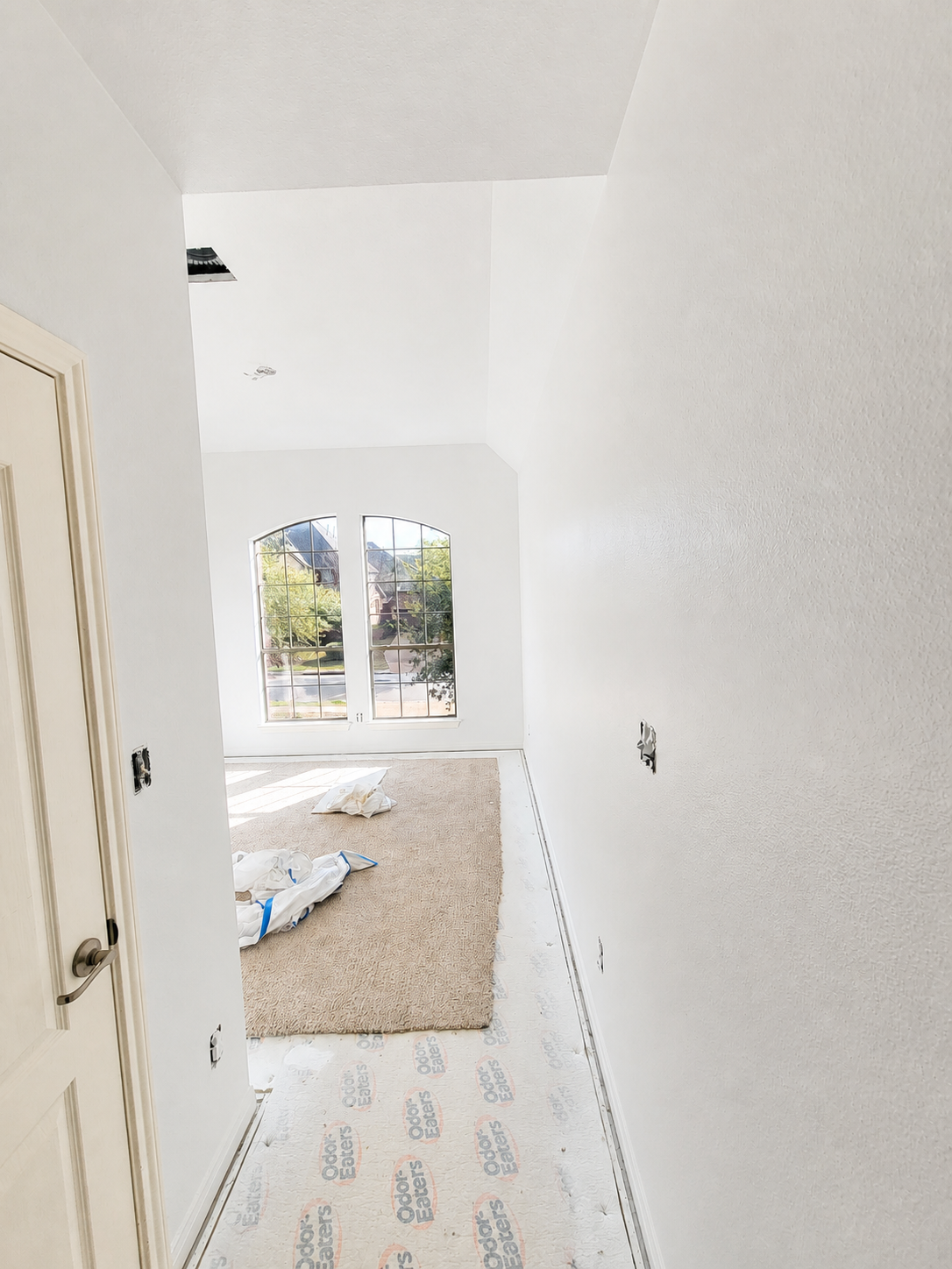 Interior walls and floor protected during painting preparation