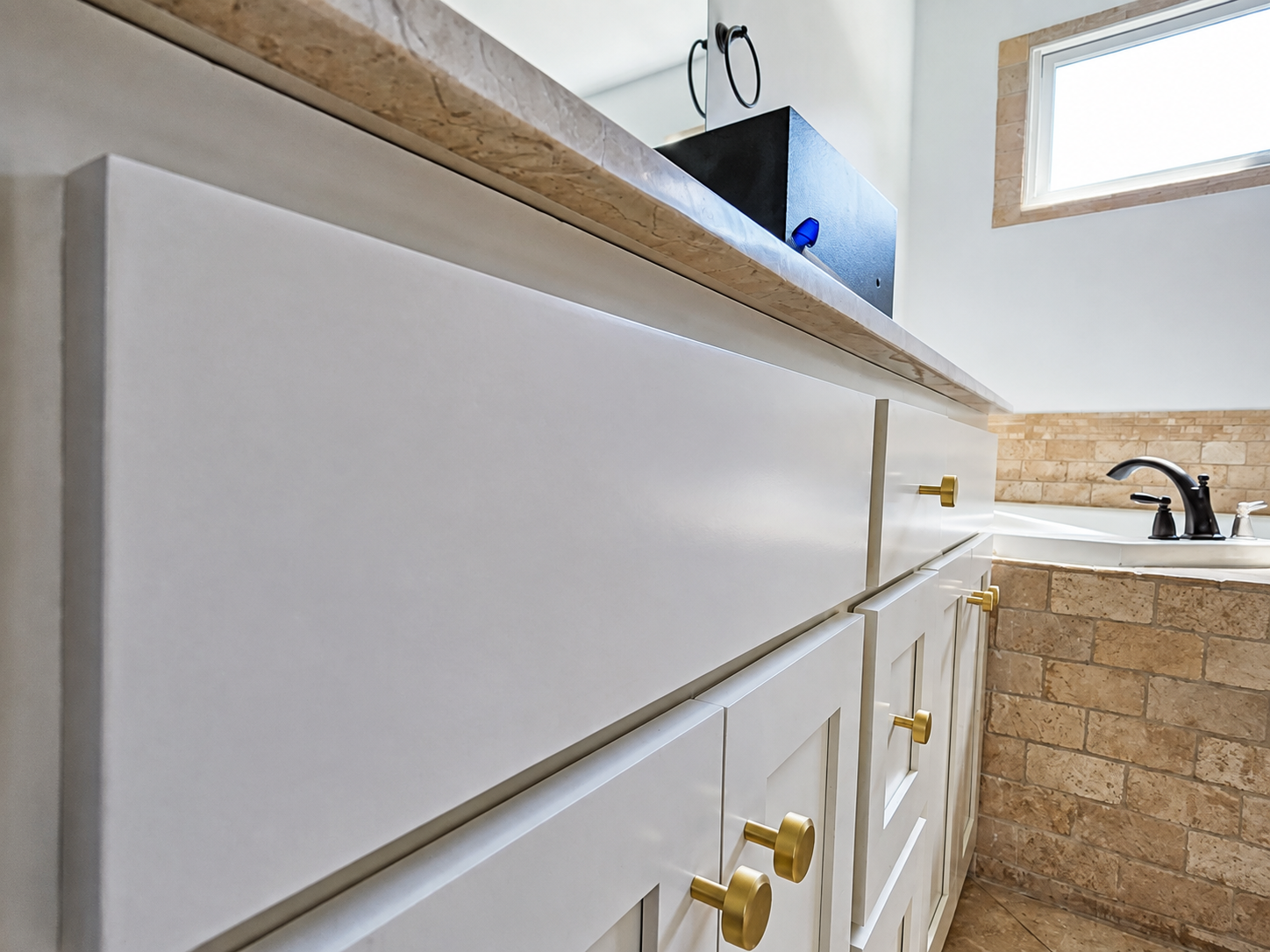 Close detail of smooth painted cabinet surfaces and hardware