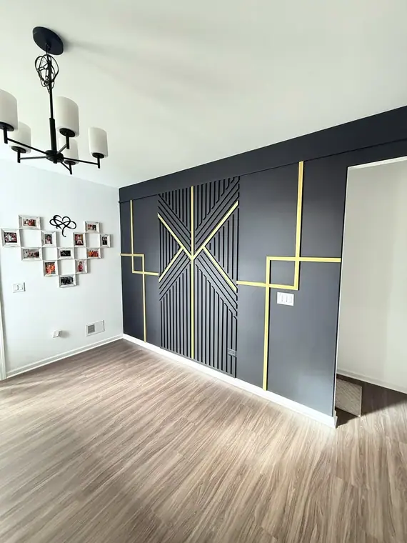 Finished black and gold geometric accent wall in an Austin area home