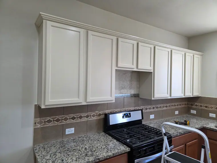 Freshly painted white kitchen cabinets in an Austin area home