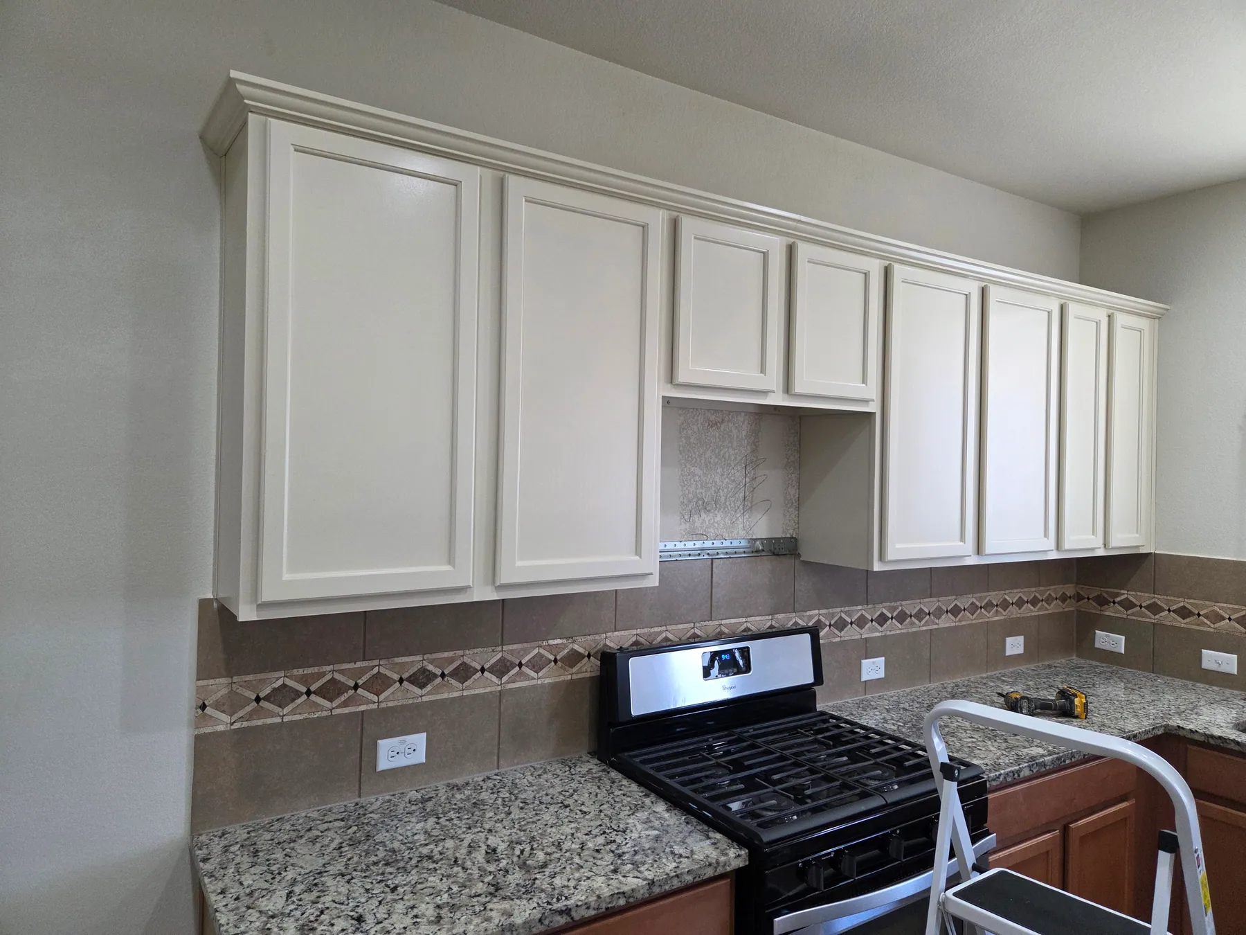 Freshly painted white kitchen cabinets in an Austin area home