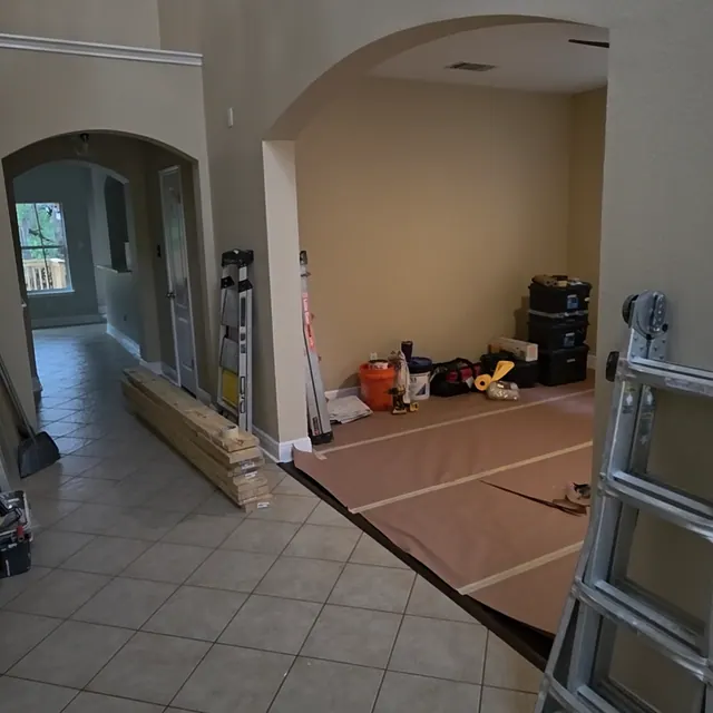 Entry room work area before flooring and finish updates