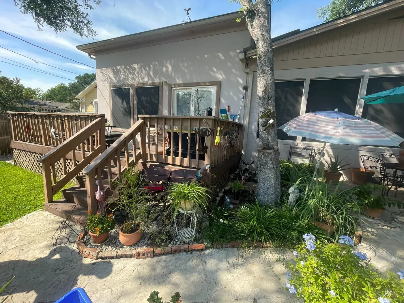 Deck project with an existing older deck beside an unfinished section with white lattice skirting