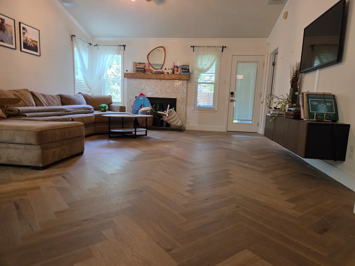 Completed wood-look flooring installation in an Austin, Texas living room