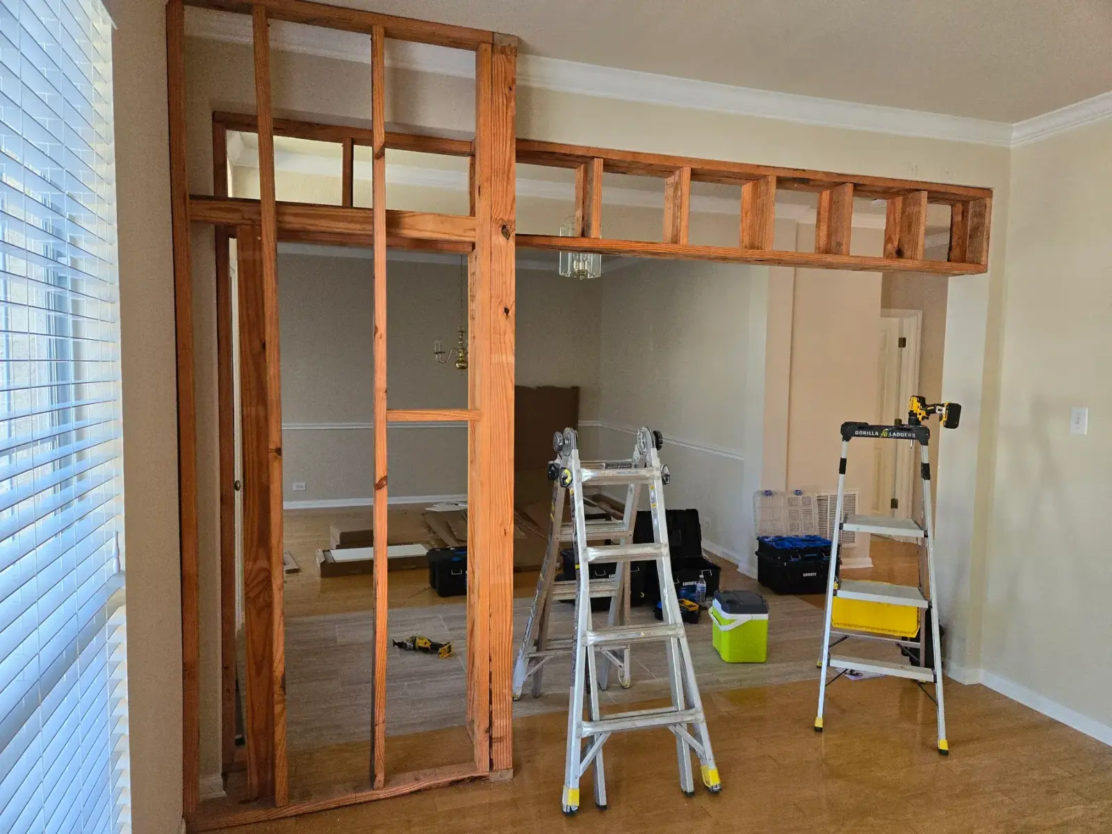 Interior wall framing and a new opening under construction in a living area