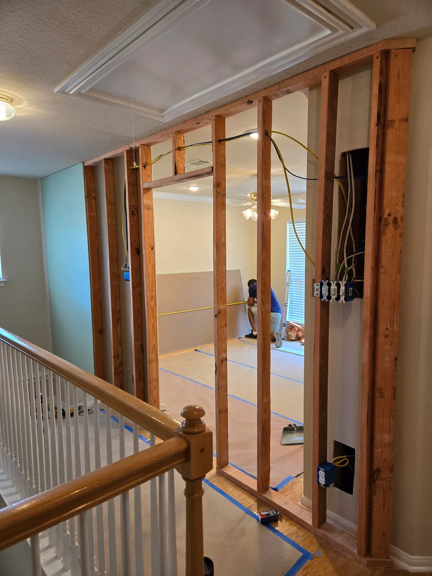 Interior wall framing with electrical wiring during a home renovation